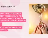 Złoty puchar w rękach wielu osób symbolizuje sukces i nagrodę jubileuszową. Analiza prawna Karolina Niedzielskiej.