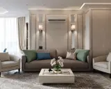 Soggiorno elegante con divano marrone, poltrone beige e tavolino bianco. Un perfetto esempio di arredamento contemporaneo chic.