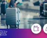 Szara walizka na lotnisku, ikony wymiarów i wagi, logo Wizz Air.