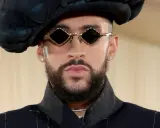 Bad Bunny at the Met Gala, sporting diamond-shaped sunglasses and a dramatic black hat.