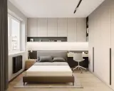 Dormitorio moderno con cama, escritorio y armarios empotrados. Ideas de almacenamiento de dormitorio para maximizar el espacio.