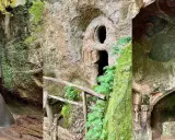 Cascata e grotte scavate nella roccia, tra cui un'antica cappella affrescata, nel suggestivo eremo di Poggio Conte.