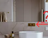 Złota bateria podtynkowa nad białą umywalką. Jaka powinna być idealna wysokość wylewki nad umywalką?