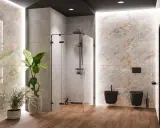 Nowoczesna łazienka z prysznicem walk-in. Deszczownica zamontowana na odpowiedniej wysokości, obok czarna miska WC i bidet.