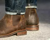 These rugged brown leather chelsea boots, paired with cuffed denim, prove that chelsea boots are in style and perfect for a casual yet sharp look.