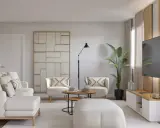Salón moderno con sofá y sillones blancos, mesa de centro, planta y TV. Ideas para como decorar un salón con muebles blancos.