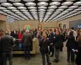 A crowd gathers at a Sotheby's event, a vibrant scene in the contemporary art market.