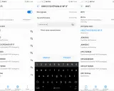 Ekran telefonu z listą dostępnych sieci Wi-Fi i klawiaturą ekranową.