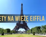 Wieża Eiffla w Paryżu, z napisem "Bilety na Wieżę Eiffla".
