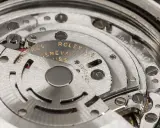 Dettaglio del movimento di un Rolex, con incisioni "Montres Rolex Geneva Swiss" e "Rattrapante".