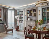 Elegancki salon w stylu art deco z dwoma regałami pełnymi książek, okrągłym stołem i wygodnym fotelem.