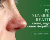 Primo piano di un occhio e naso con arrossamento evidente, simbolo di pelle sensibile e reattiva. Il testo spiega cause e rimedi.