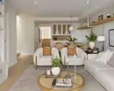 Salón rectangular dos ambientes con sofás blancos, sillones de borrego y mesa de centro de ratán.