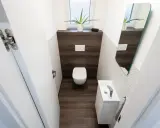 Un bagno piccolo con WC, lavandino compatto e specchio. Ottime idee per sfruttare al meglio lo spazio.