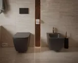 Nowoczesna łazienka z podwieszanym WC i bidetem. Dowiedz się, jak siadać na bidet, by higiena była komfortowa.