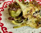 Alcachofas asadas con queso rallado, perfectas para tus recetas.