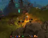 Gracz w grze typu hack and slash walczy z szkieletami w płomieniach.