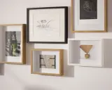 Galeria ścienna z różnymi obrazami i ramkami. Dowiedz się, jak powiesić obraz, tworząc własną, unikalną kompozycję.