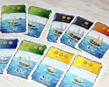 Karty do gry "Port Royale" przedstawiające statki: fluitę, skiff, galeon, szalupę i fregatę, gotowe do morskiej przygody.