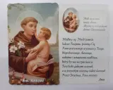 Święty Antoni z Dzieciątkiem Jezus, otoczony kwiatami lilii. Obok tekst modlitwy do świętego Antoniego.