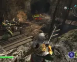 Gracze w grze Władca Pierścieni walczą z Uruk-hai Mage w jaskini.