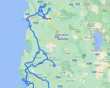 Trasa drogowa przez Albanię, pokazująca główne **lotniska w Albanii** i miasta takie jak Tirana, Durrës, Fier i Korcza.