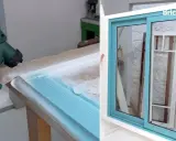 Pistola Bosch pintando marco de ventana de aluminio de color azul turquesa. El resultado es una ventana renovada y brillante.