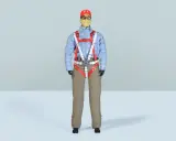 Eine detailreiche **Pilotenpuppe** mit kariertem Hemd, beige Hose und auffälligem roten Gurtzeug.
