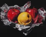 A still life painting by skilled artists depicts two red apples and one yellow apple nestled in crumpled silver foil against a black background.