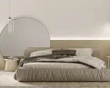 Przytulna sypialnia inspiracje: minimalistyczne łóżko z lnianą pościelą, duża okrągła lustrzana ściana i drewniane akcenty tworzą spokojną atmosferę.