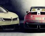Zwei BMW-Konzeptfahrzeuge, ein cremefarbener und ein rosafarbener, stehen nebeneinander. Der cremefarbene BMW i1 hat eine markante Frontpartie.
