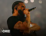 Drake w Polsce, na scenie, z mikrofonem w dłoni, w blasku świateł.