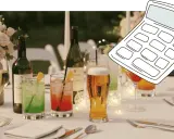 Hochzeitstisch mit Getränken und einer Rechner-Grafik. Hilft bei der Planung: wie viel wein pro person hochzeit.