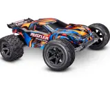 Ein bunter Traxxas Rustler stadium truck mit schwarzem Heckspoiler und großen Reifen, bereit für jedes Abenteuer.