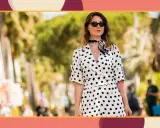 A woman in a stylish polka dot outfit, perfect for inspiration on what to wear to a beach wedding.