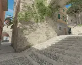 Kamienna ścieżka i schody w klimacie tuscan cs go, z widokiem na latarnię morską i budynki.