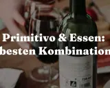 Primitivo-Traube: Entdecke die besten Kombinationen mit Essen. Ein Glas Rotwein und frische Erdbeeren laden zum Genuss ein.