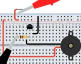 Układ na płytce stykowej z tranzystorem mosfet asg, rezystorem i brzęczykiem.