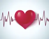 Czerwone serce na tle wykresu EKG. Symbolizuje zdrowie, życie i walkę z wadami serca, takimi jak np. VSD.