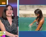 Presentadora en estudio y mujer en bikini chapoteando en el agua. Parece que la regla se corta con el agua.