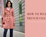 Modello elegante mostra come indossare il trench donna con stile, abbinato a pantaloni blu e camicia bianca.