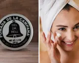 Pomada Dr. Bell's, la crema la campana, aplicada en el rostro de una mujer sonriente con toalla en la cabeza.
