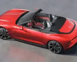 Czerwony mg roadster z czarnym dachem i sportowymi felgami, gotowy na przejażdżkę.