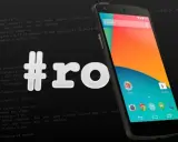 Smartfon z Androidem i hasztagiem #ro, sugerującym jak zrootować telefon. W tle widać fragmenty kodu.