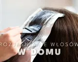 Profesjonalne rozjaśnianie czarnych włosów w domu. Pędzel nakłada rozjaśniacz na pasma owinięte folią.