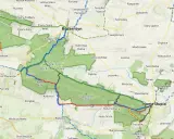 Mapa turystyczna z zaznaczonymi szlakami w Świętokrzyskim Parku Narodowym, prowadzącymi przez Bodzentyn i Nową Słupię.
