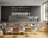 Moderna zona giorno con idee salotto e sala da pranzo insieme. Divano, libreria, cucina a isola e tavolo da pranzo con sedie bianche.