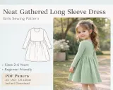 Niña con vestido verde de manga larga y patrón de costura.