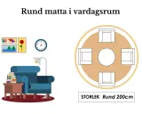 En rund matta under ett runt matbord med fyra stolar. Storlek 200cm.
