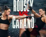 Ronda Rousey in azione, in un poster di un film di combattimento. La sua avversaria è Gina Carano.
